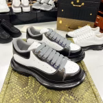 Alexander McQueen Classic White Sneakers with Black Soles