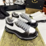 Alexander McQueen Classic White Sneakers with Black Soles
