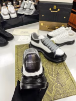 Alexander McQueen Classic White Sneakers with Black Soles - Image 2