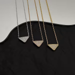 𝐏𝐑𝐀𝐃𝐀 Triangle Logo Necklace - Image 9